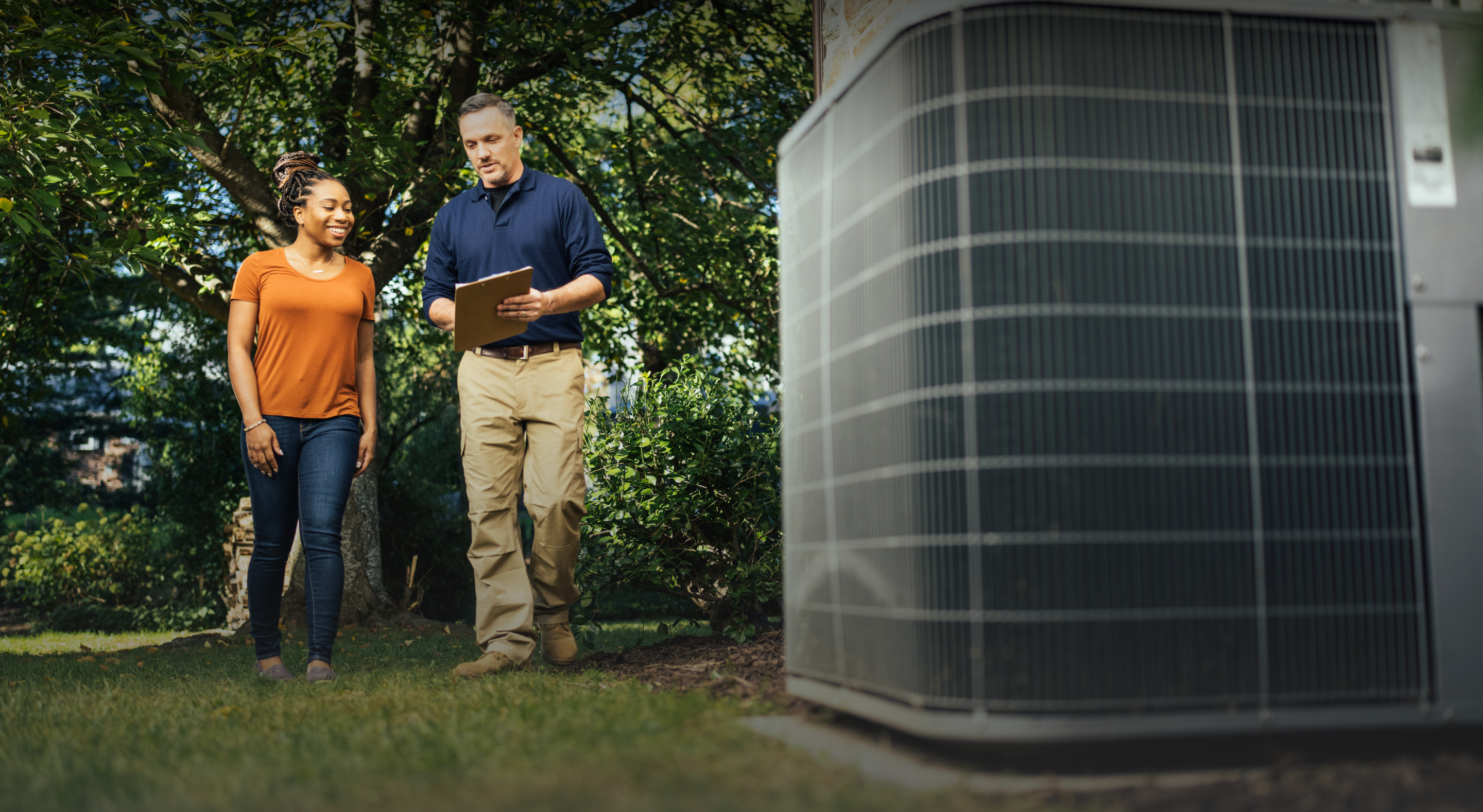 Contractor showing a home owner How to save using an HVAC